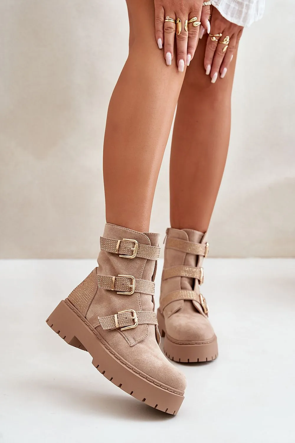 Stylish straps with gold buckles boots
